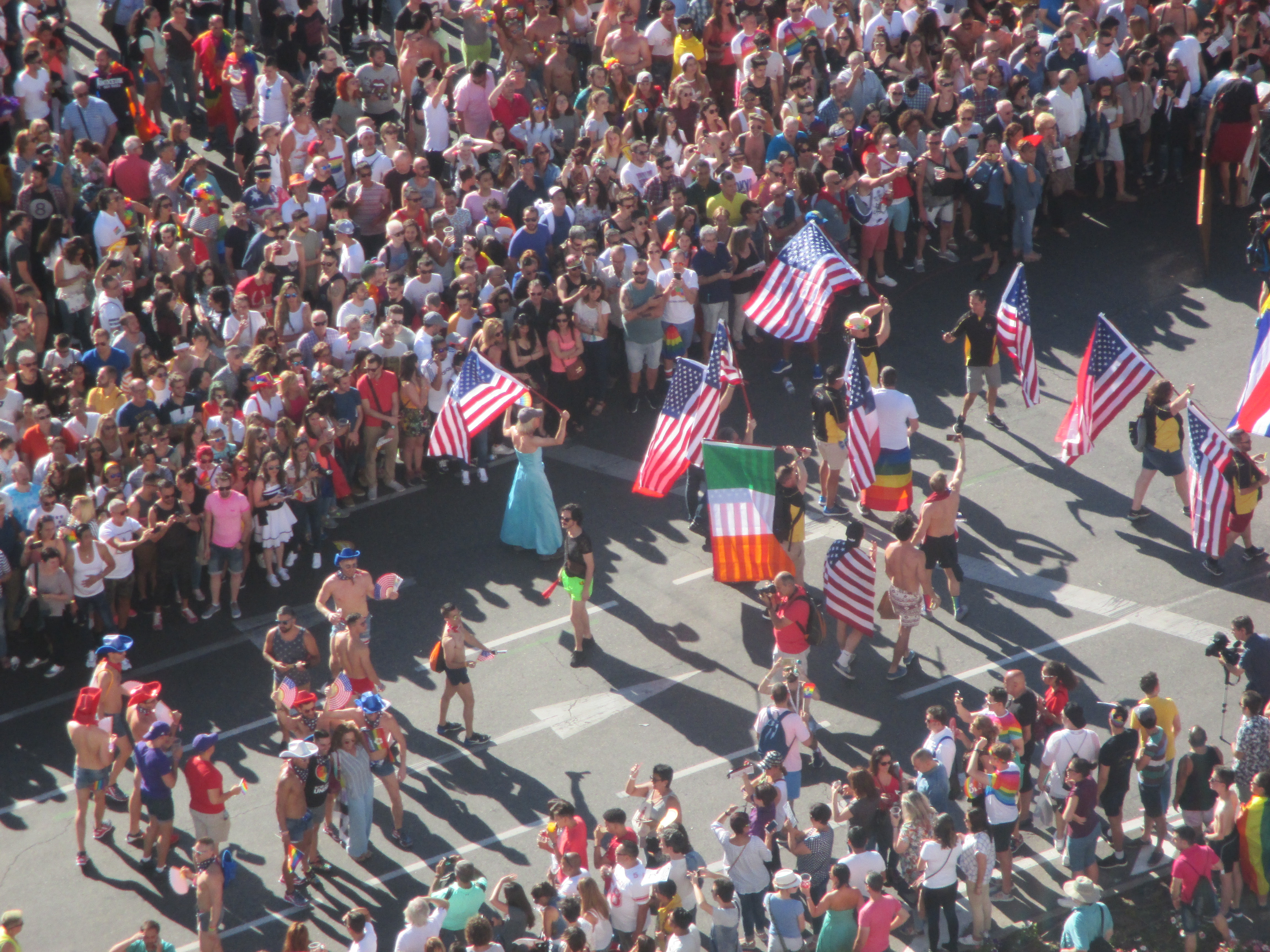 Contingent with American flags, some with American flags on one side and the flags from other countries, including Ireland, on the other side.