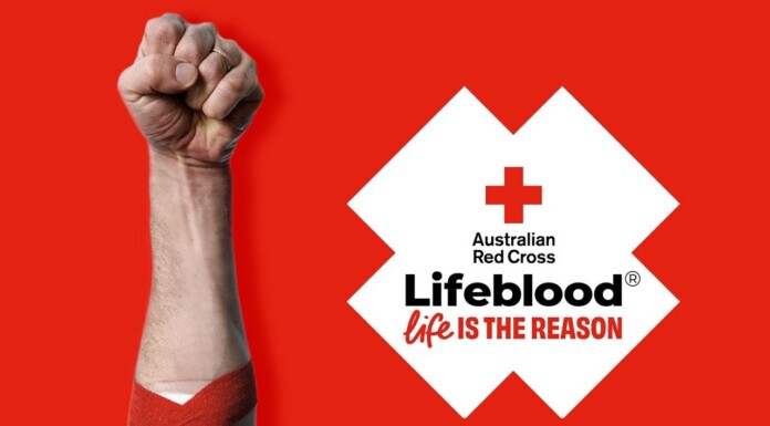 Raised fist with a red bandage on the forearm, set against a red background, next to the Lifeblood logo and the slogan 'Life is the reason'.