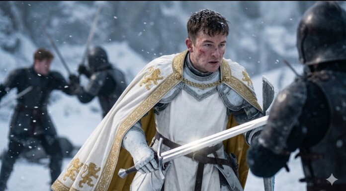 Kit Connor Leads Star-Studded Cast In A24’s Elden Ring Film Adaptation Knight in white armor with a gold-embroidered cape faces an opponent in a snowy battlefield, sword drawn.