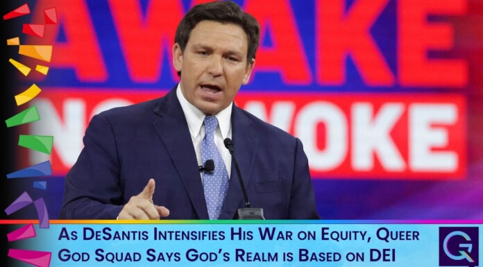 Male speaker in a navy suit delivers a televised speech, with a bold red backdrop and a blue caption bar reading: 'As DeSantis Intensifies His War on Equity, Queer God Squad Says God’s Realm is Based on DEI'
