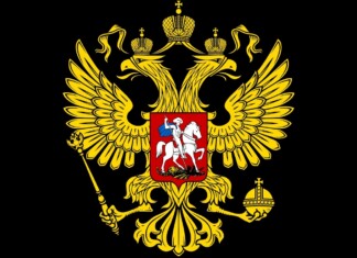 Gold double-headed eagle with crowns, scepter, and orb on a black field, bearing a red shield with a mounted knight (Russian coat of arms).