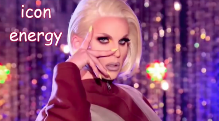 Person with platinum blonde hair posing against a purple background, making a hand gesture near the eyes, with the words "icon energy" in the upper left.