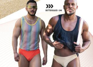Two muscular men in retro mesh tops and briefs pose for a Butter Black ad, walking toward the camera with confident stances.
