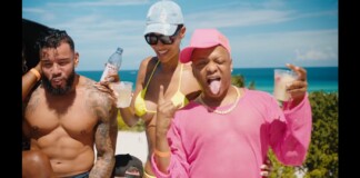 Three friends at the beach pose and sip drinks, with the ocean in the background and bright sunny weather时 (informative)