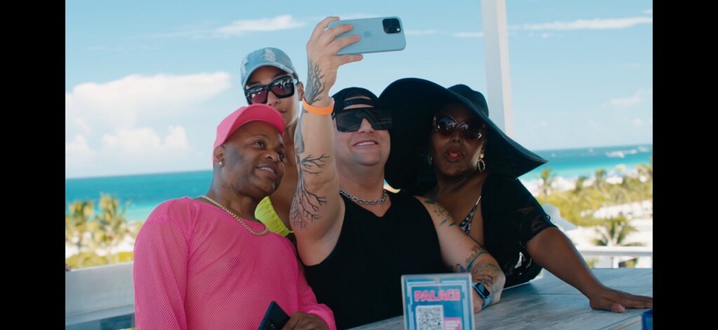 Prime Video Premieres “Pageant Queens: Our Story Behind the Crown” | Hotspots Magazine Hotspots Magazine A group of four friends taking a selfie at an outdoor seaside venue, with the ocean and palm trees in the background and everyone wearing sunglasses or hats.