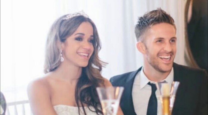 SNL Gay Writer Jimmy Fowlie Says His Sister’s Disappearance Case Is Now A Homicide Investigation Smiling couple at a wedding reception, woman in a strapless white dress and man in a suit with champagne glasses.