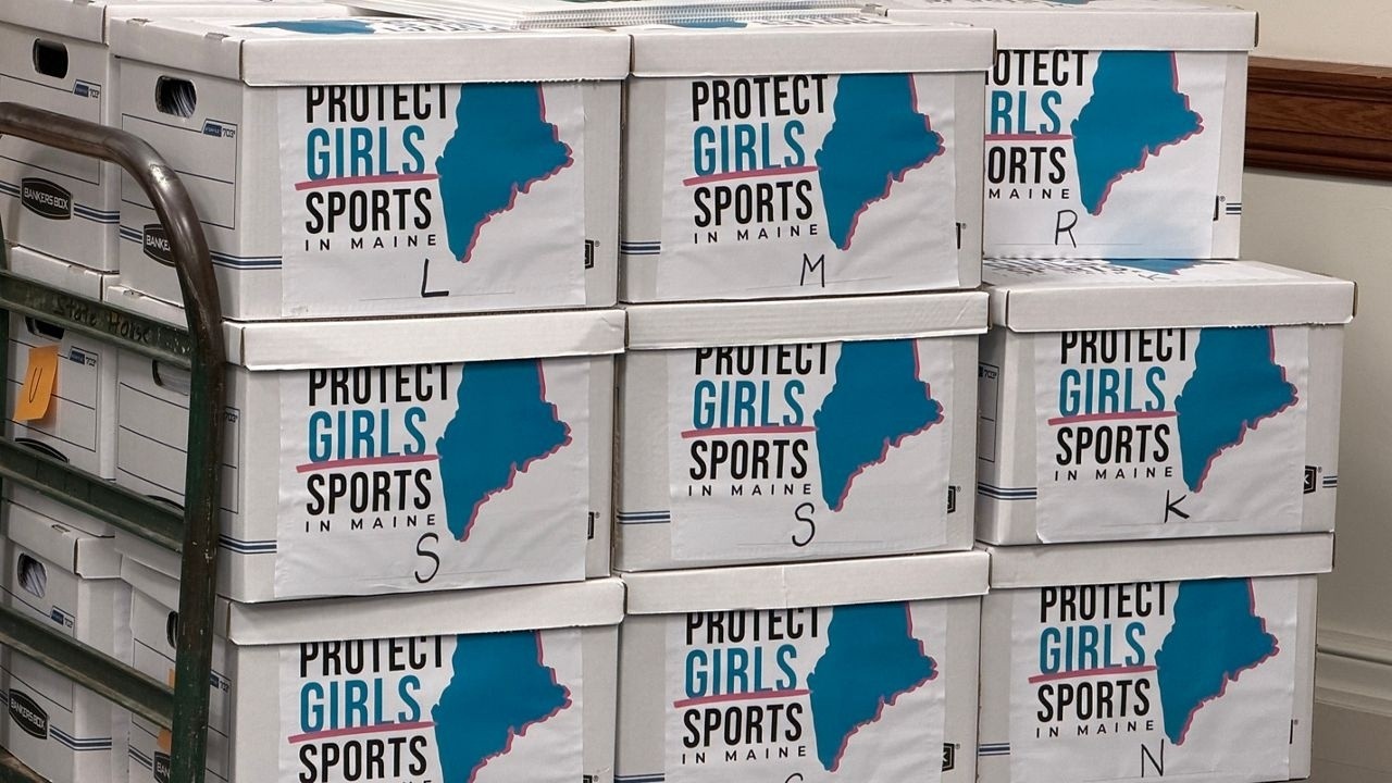 Stacked white boxes with a blue outline map of Maine and the words 'Protect Girls in Maine Sports'.