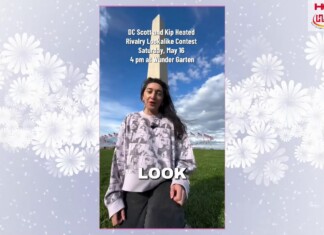 Woman in a patterned sweater stands outdoors on a grassy field with a tall obelisk; overlaid text promotes a rivalry lookalike contest and logos.
