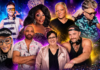 Gay Disney Returns to Orlando Eight club DJs and drag performers pose around a colorful stage with a mixer in the foreground.