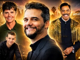 Group portrait of four men smiling against a golden Hollywood skyline and film reels backdrop, like a movie poster.
