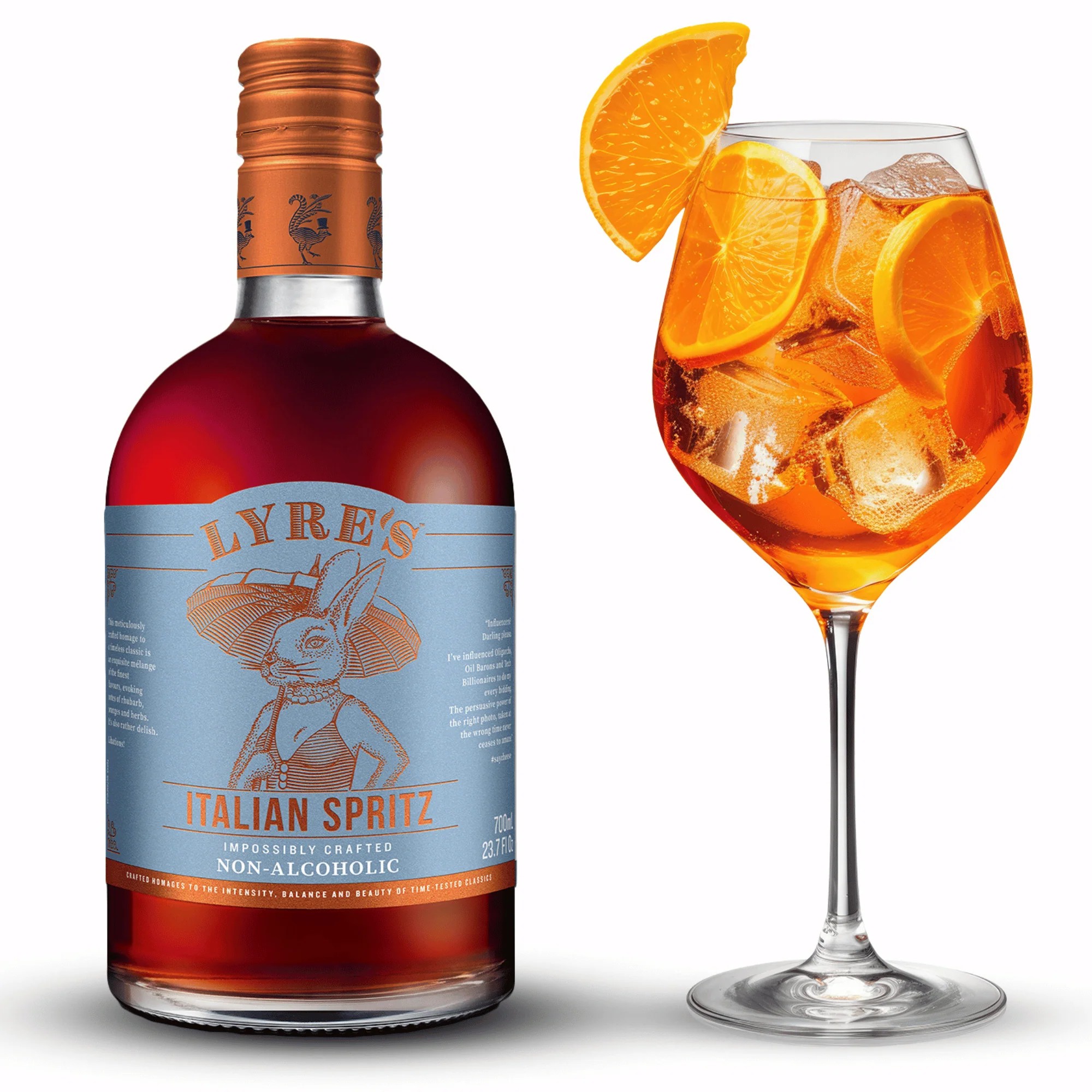 Bottle of Lyre's Italian Spritz beside a glass filled with orange spritz and ice, highlighting the non-alcoholic beverage.