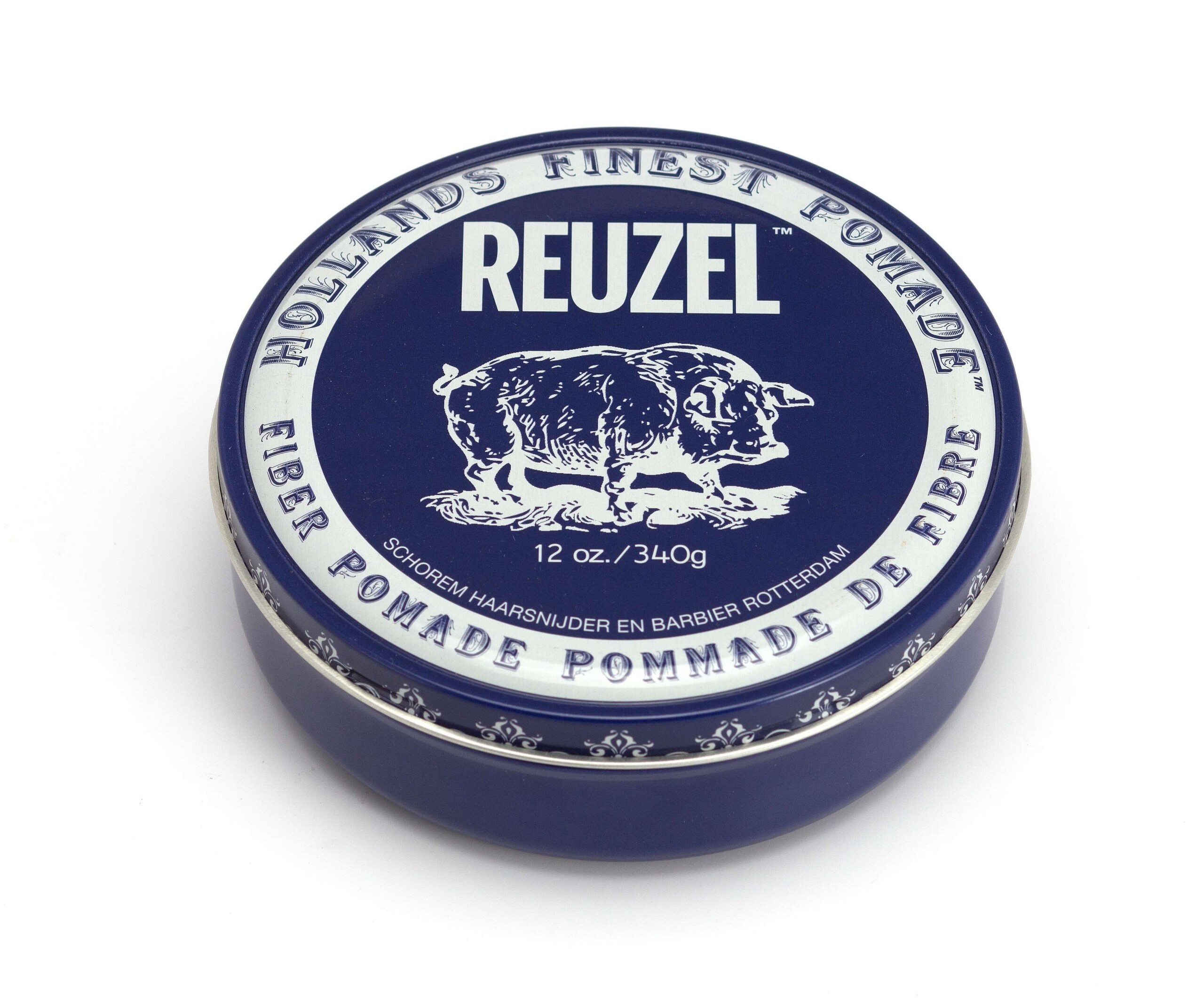 Round blue tin of Reuzel hair pomade with a white label and pig illustration on the lid