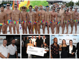 Group of men in rainbow-striped swimsuits posing shirtless on a dock with a boat and yellow-green balloons in the background