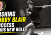 Wishing Bobby Blair Success in His New Role Black-and-white tennis action image with the bold headline 'WISHING BOBBY BLAIR SUCCESS IN HIS NEW ROLE' and a circular portrait of Bobby Blair in the top-left with a yellow border.