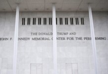 Marble wall with engraved text reading: 'THE DONALD TRUMP AND THE JOHN F. KENNEDY MEMORIAL CENTER FOR THE PERFORMING ARTS'