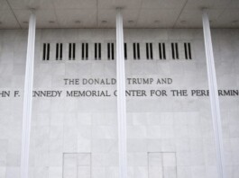 Marble wall with engraved text reading: 'THE DONALD TRUMP AND THE JOHN F. KENNEDY MEMORIAL CENTER FOR THE PERFORMING ARTS'