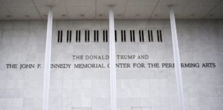 Marble wall with engraved text reading: 'THE DONALD TRUMP AND THE JOHN F. KENNEDY MEMORIAL CENTER FOR THE PERFORMING ARTS'