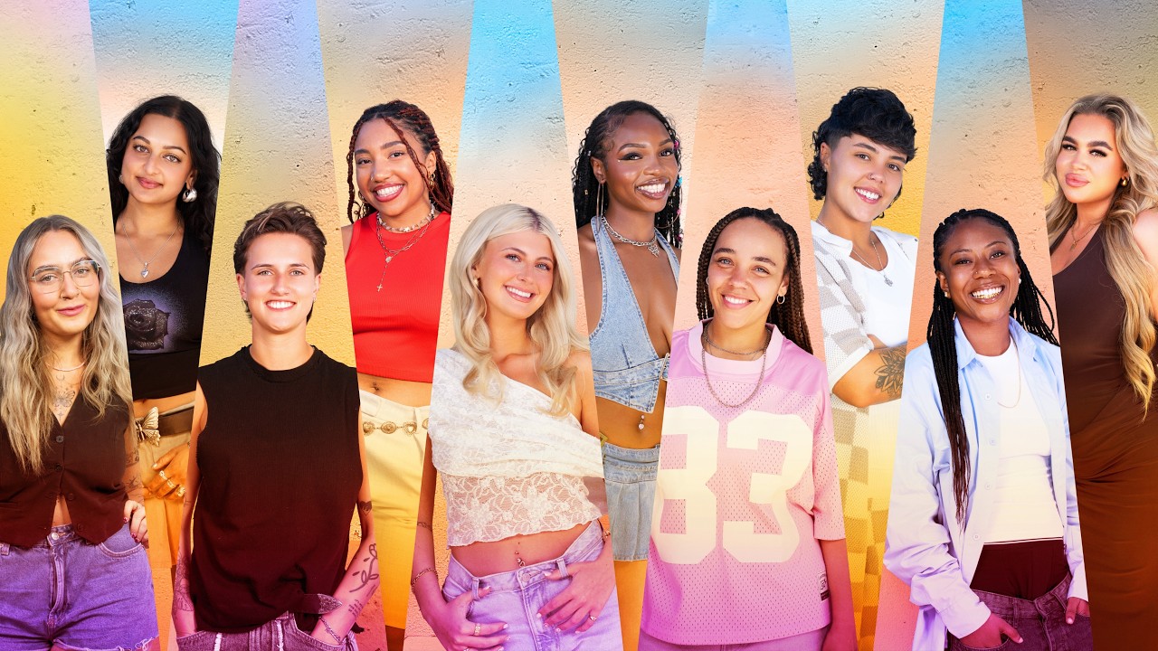 Group of diverse young women smiling together against a colorful striped mural background (vibrant, urban group portrait).