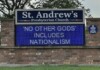 St. Andrew's Presbyterian Church sign with a blue LED marquee displaying: 'NO OTHER GODS INCLUDES NATIONALISM' on a brick base.