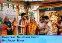 Hindu priest wearing a garland and rainbow scarf greets a diverse crowd at a temple festival, celebrating queer identity with smiles and warmth.
