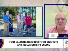 Television news split-screen: outdoor press conference on the left with five people at a podium, and a studio anchor in a pink shirt on the right.