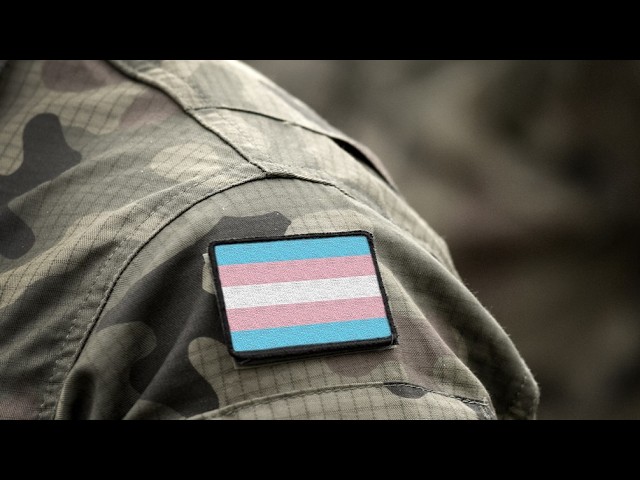 Federal Appeals Court Protects Transgender Service Members From Military Ban Camouflage military uniform sleeve with a transgender pride flag patch.