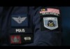 Malaysia Police Investigate Death, Arrest 51 Men Linked to an Alleged “Gay Party” Close-up of police patches on a dark uniform, including a Malaysia flag patch and a POLIS badge on the sleeve.