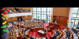Western Far-Right Groups Back Anti-LGBTQ+ Ghana Conference Ghana conference hall with delegates seated in a circular chamber; a speaker at the podium near flags, with a banner stating 'Western Far-Right Groups Back Anti-LGBTQ+ Ghana Conference'