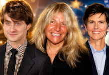Three smiling adults posing for a group photo at an event, standing close together against a festive background.