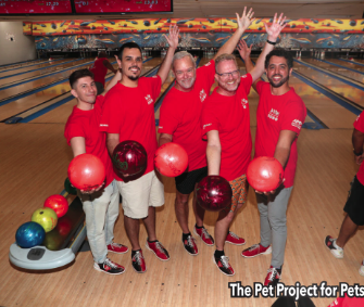 What’s Hot South Florida: July 16 – July 29 | Hotspots Magazine Hotspots Magazine Group of six men in red shirts posing together on a bowling lane, each holding a red bowling ball and smiling sold at a bowling alley.