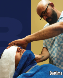 What’s Hot South Florida: July 16 – July 29 | Hotspots Magazine Hotspots Magazine Barber wearing glasses gives a scalp massage to a client wrapped in a blue towel in a barbershop.
