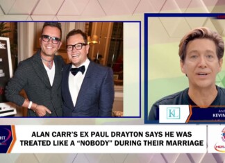 Alan Carr’s Ex Paul Drayton Says He Was Treated Like a “Nobody” During Their Marriage Two men in suits pose together at an awards event on a blue-framed split-screen, with a TV news anchor on the right set.