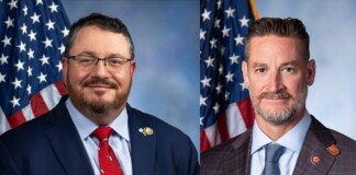 Two men in formal suits posing for official portraits with American flags in the background, side by side view.