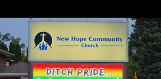 Church billboard for New Hope Community Church with a rainbow message 'Ditch Pride... Embrace Humility!'