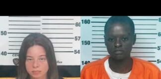 Side-by-side mugshots against a height chart: left, a light-skinned woman with shoulder-length brown hair in a black shirt; right, a dark-skinned man with short hair wearing an orange jumpsuit over a white shirt.