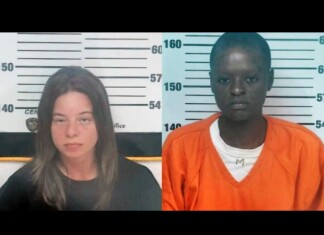 Ohio Resident Helps Capture The Lesbian Couple Wanted in Maryland Mother’s Murder Side-by-side mugshots against a height chart: left, a light-skinned woman with shoulder-length brown hair in a black shirt; right, a dark-skinned man with short hair wearing an orange jumpsuit over a white shirt.