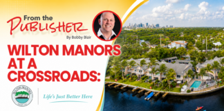 Promotional banner: Wilton Manors at a Crossroads with a portrait, city skyline, and waterway image; bold red title and crest logos.