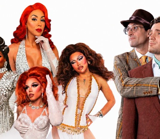Group portrait of five drag queens in glamorous gowns and makeup posing next to two men in retro suits on a white background.