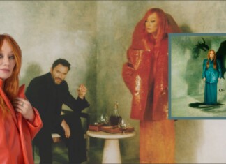 Tori Amos Is Still Fighting for Love Red-haired woman in an orange coat stands at left; a man in black sits behind beside a table with glasses, against a moody green backdrop; an inset album cover appears on the right.