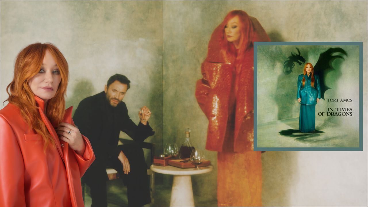 Feature_Tori Amos _1280x720 Red-haired woman in an orange coat stands at left; a man in black sits behind beside a table with glasses, against a moody green backdrop; an inset album cover appears on the right.