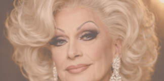 Close-up portrait of a glamorous older woman with platinum blonde hair and diamond earrings.