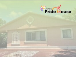 Small single-story house with light trim and a Pride House logo in the top-right corner.