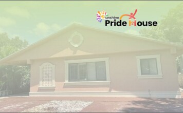 Non-profit Advocacy – Sunshine Pride House: Giving LGBTQ+ Young People More Than a Place to Sleep Small single-story house with light trim and a Pride House logo in the top-right corner.