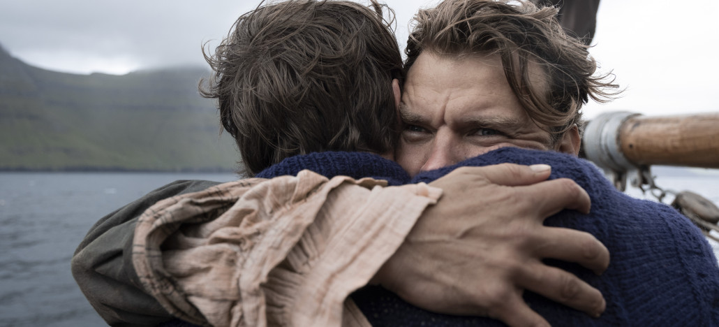 Outshine Film Festival’s Fall Edition – Fort Lauderdale and Miami from Oct 15-25 | Hotspots Magazine Hotspots Magazine Two men embrace on a boat, one man's eyes showing emotion as they hug with the sea and mountains in the background.